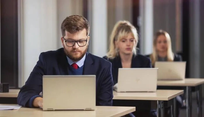 Employees working at laptops